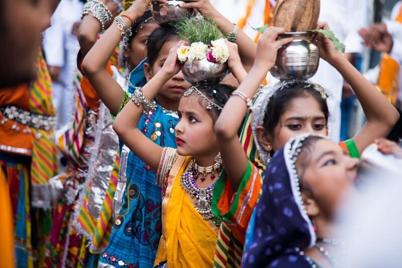 traditional dressed girls going for gangaur puja