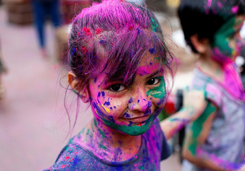 a girl play holi