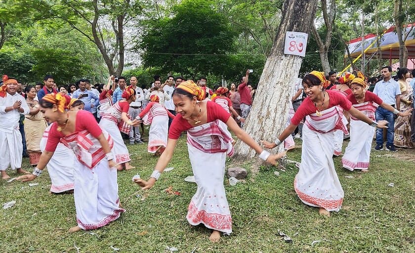 group of assam girls performing bihu cultural dance